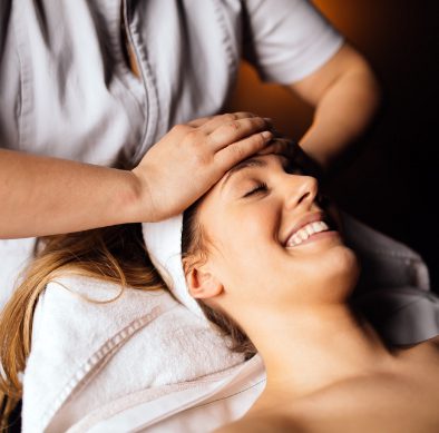 Sports massage therapist relieving muscle tension for athlete